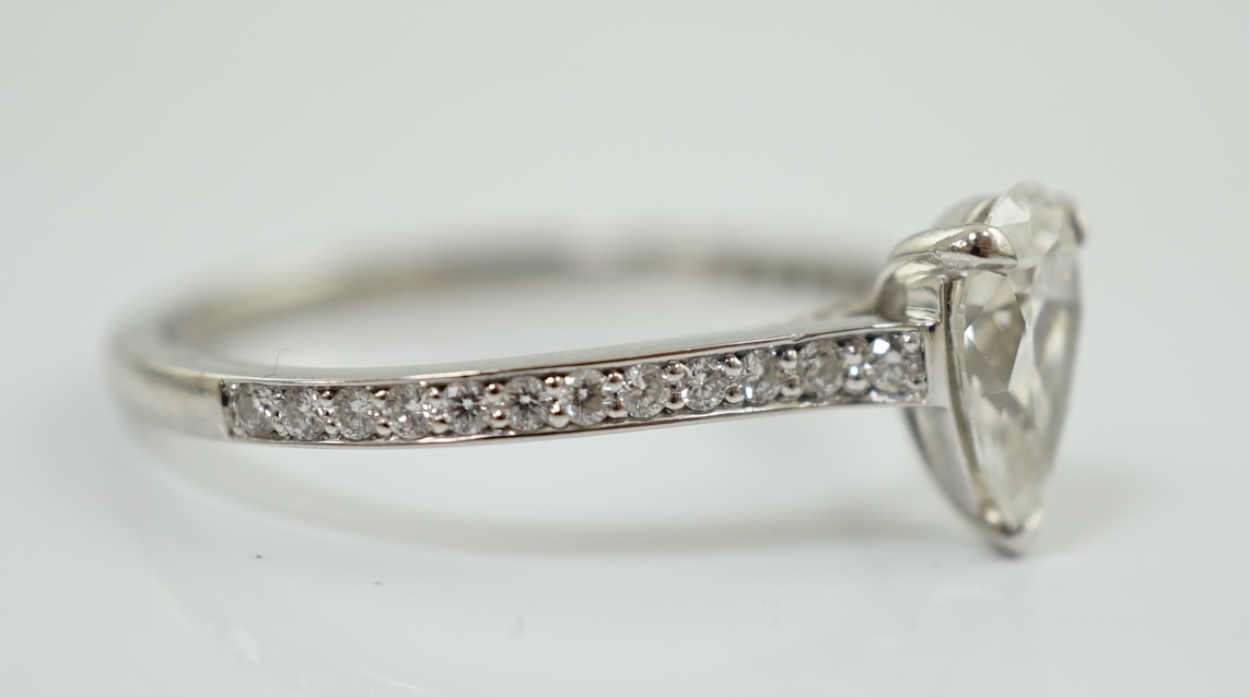 A recent Boodles platinum and single stone pear cut diamond set Harmony design ring, with diamond chip set shoulders and setting